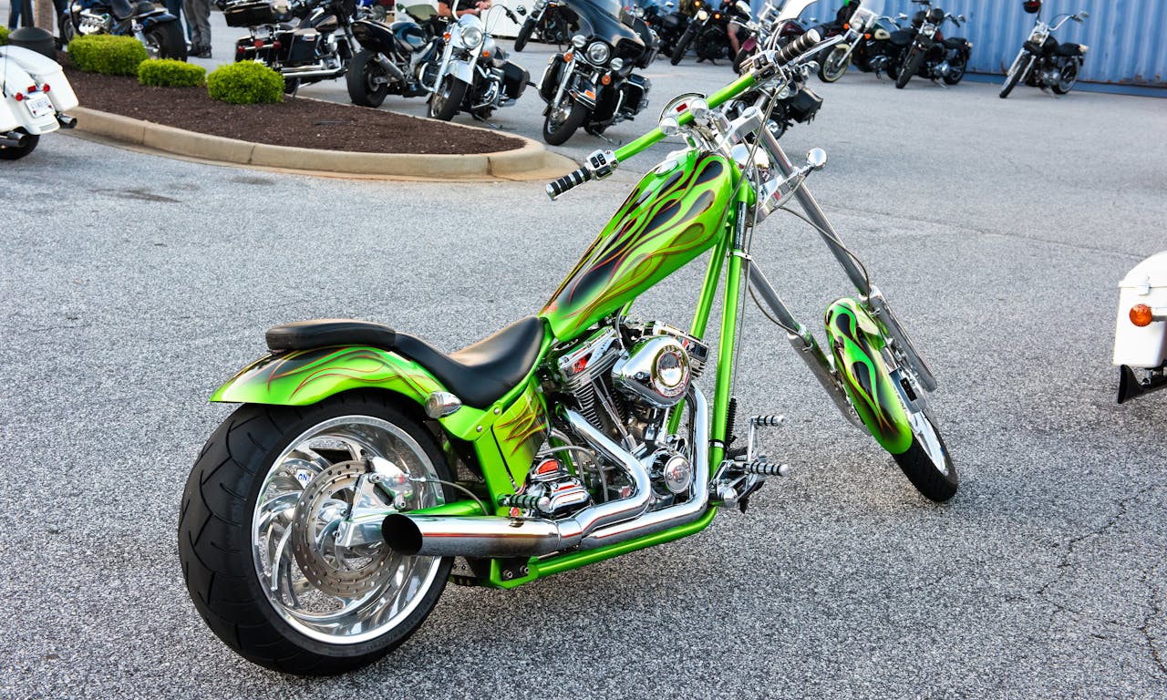 hero-img-02 A vibrant custom green motorcycle with chrome detailing parked outdoors.